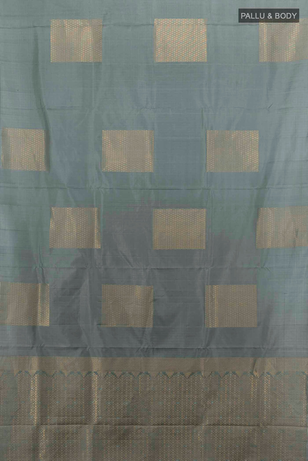 Flat view of Grey Soft Silk Saree with Zari Butta on the body and Zari Border