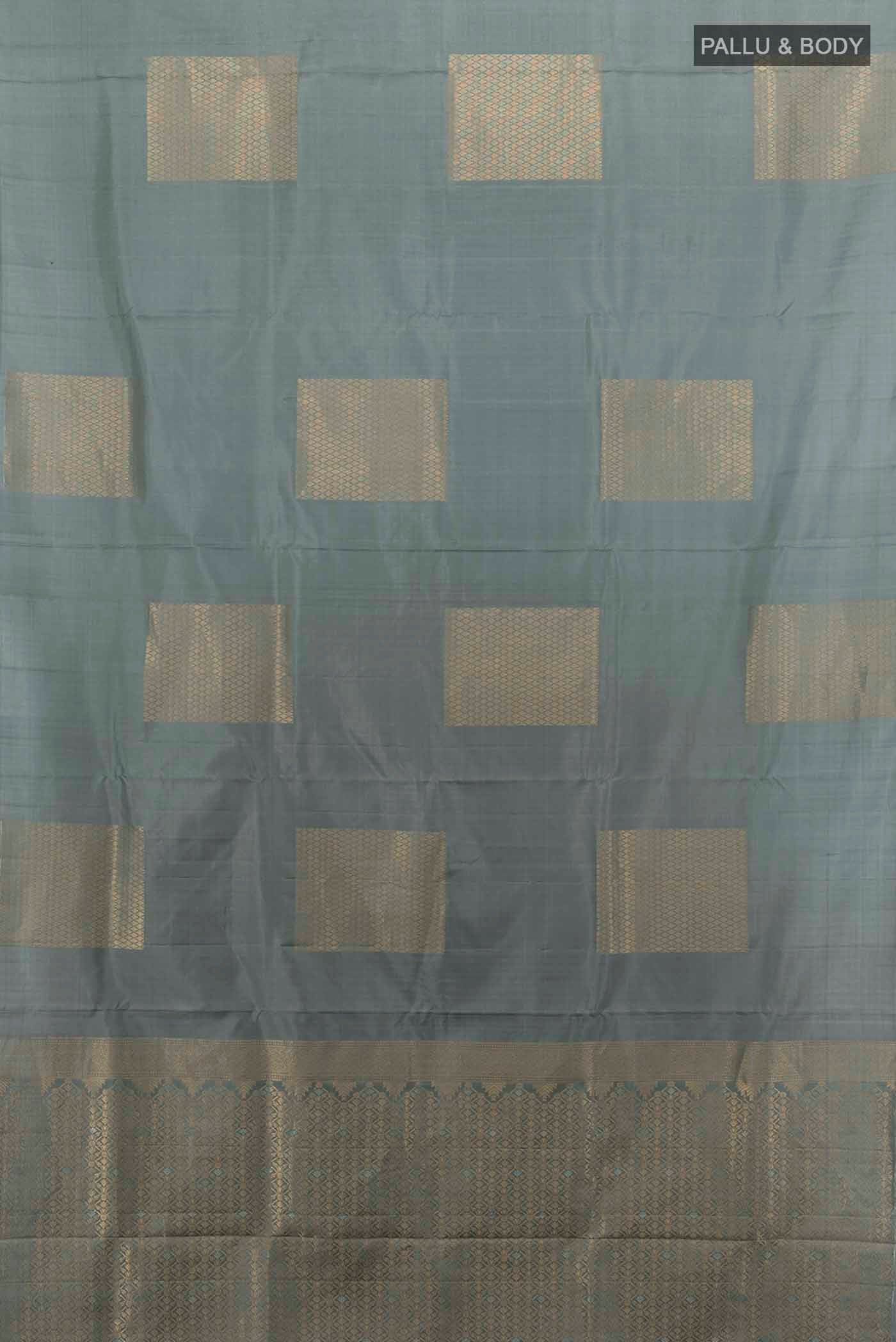 Flat view of Grey Soft Silk Saree with Zari Butta on the body and Zari Border