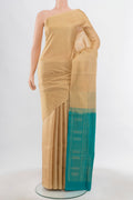 Beige Soft Silk Saree with Zari Butta on the body and Silk Border.  displayed on a mannequin
