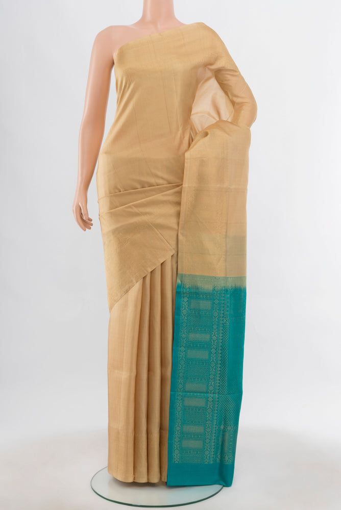 Beige Soft Silk Saree with Zari Butta on the body and Silk Border.  displayed on a mannequin
