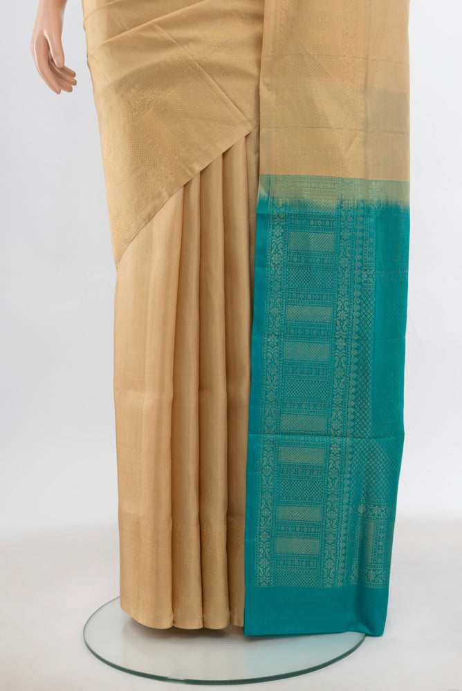 Pleats and pallu of Beige Soft Silk Saree with Zari Butta on the body and Silk Border. 