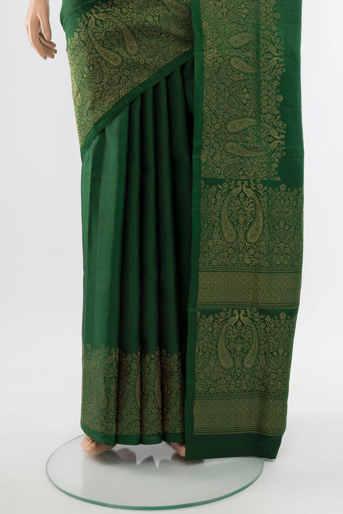 Pleats and pallu of Bottle Green Soft Silk Saree with Zari Butta on the body and Silk Border. 