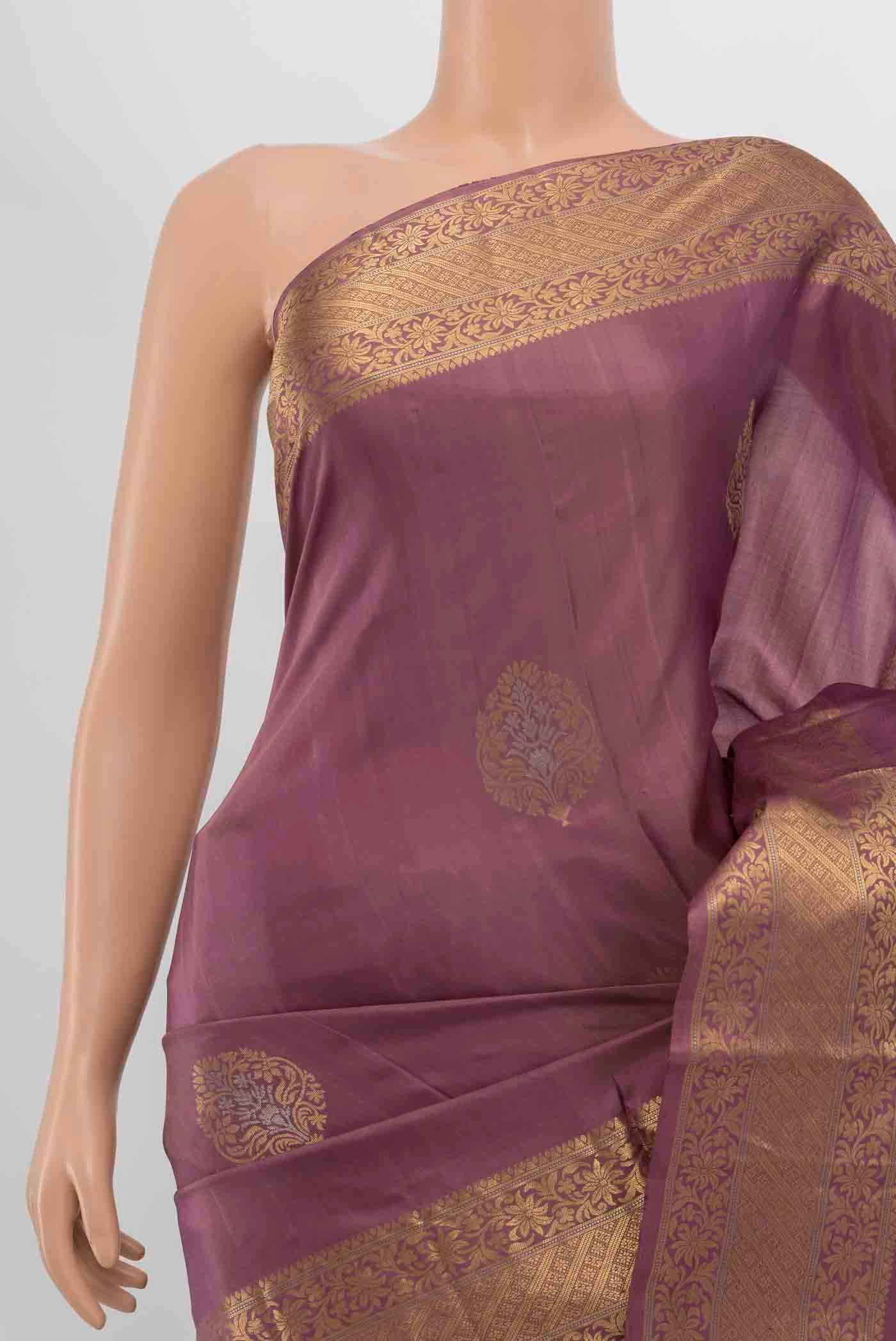 Border image of Purple Soft Silk Saree with Zari Butta on the body and Zari Border