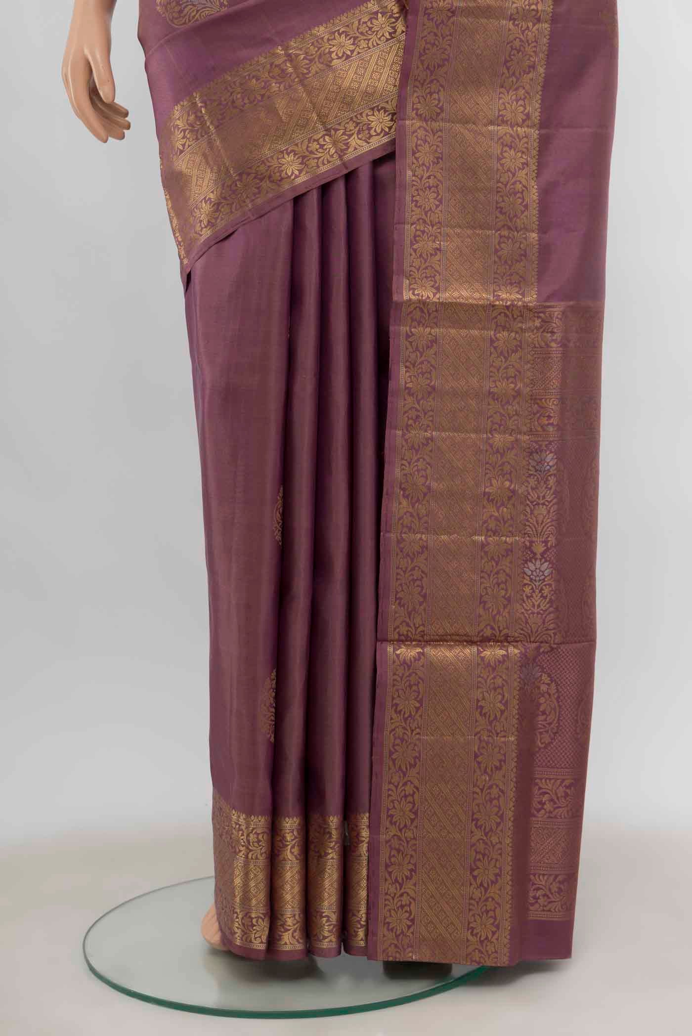 Pleats and pallu of Purple Soft Silk Saree with Zari Butta on the body and Zari Border
