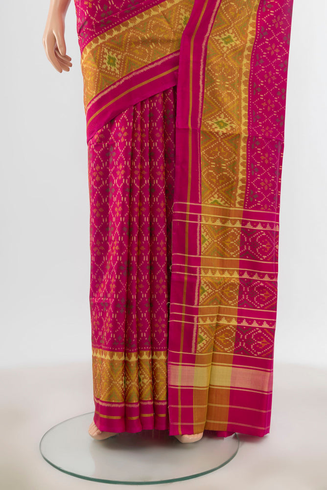 Pleats and pallu of Rani Pink Pochampally Saree with Ikat Print on the body and Silk Border. 