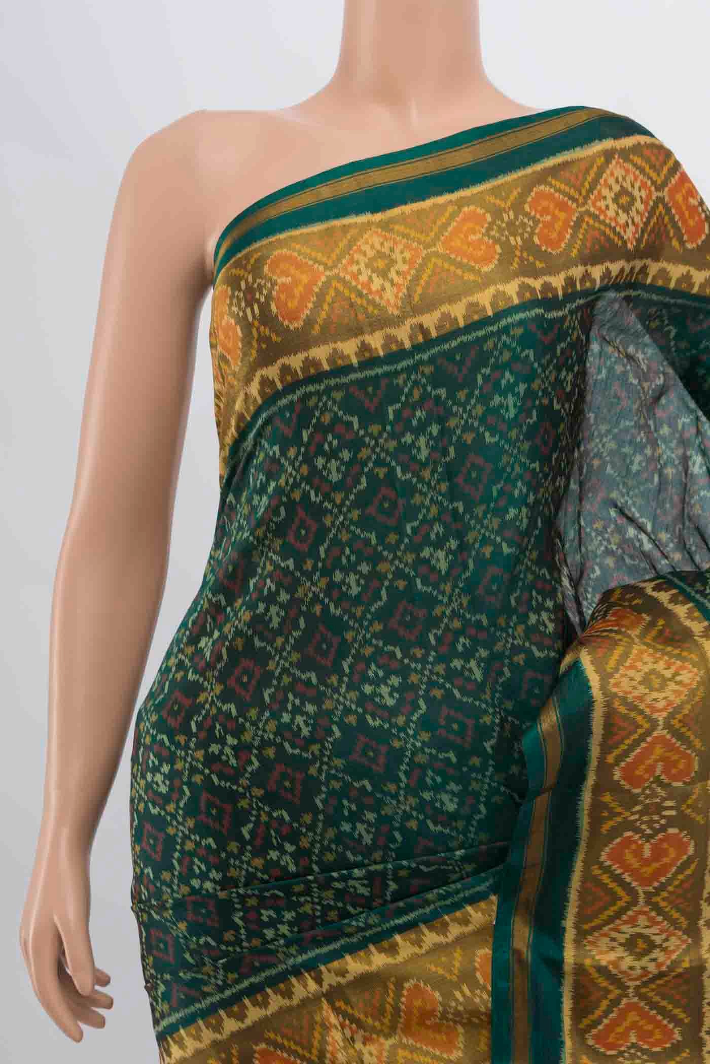 Border image of Green Rajkot Patola Silk Saree with Pure Ikat on the body and Ikat Border
