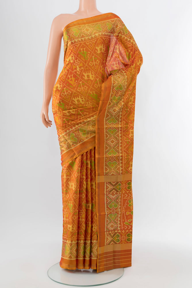 Multi Color Rajkot Patola Silk Saree with Zari Butta on the body and Silk Border.  displayed on a mannequin