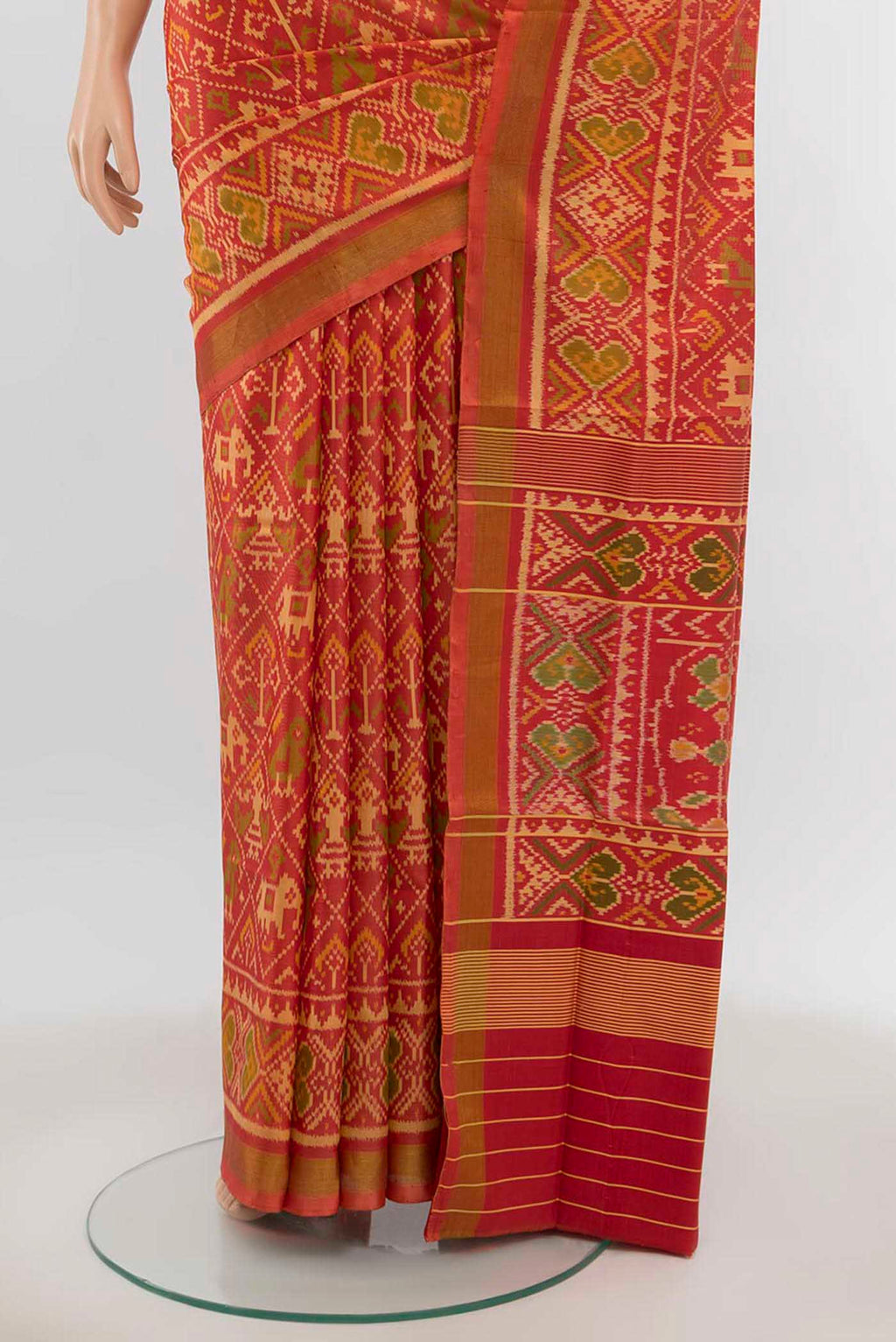 Pleats and pallu of Peach Rajkot Patola Silk Saree with Zari Butta on the body and Silk Border. 