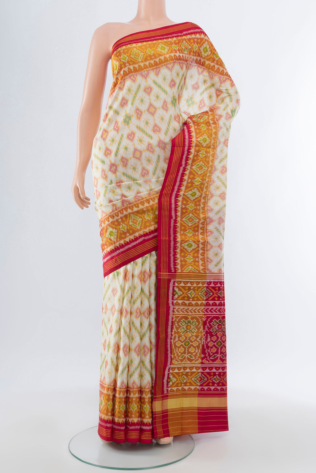 Multi Color Rajkot Patola Silk Saree with Ikat Print on the body and Silk Border.  displayed on a mannequin