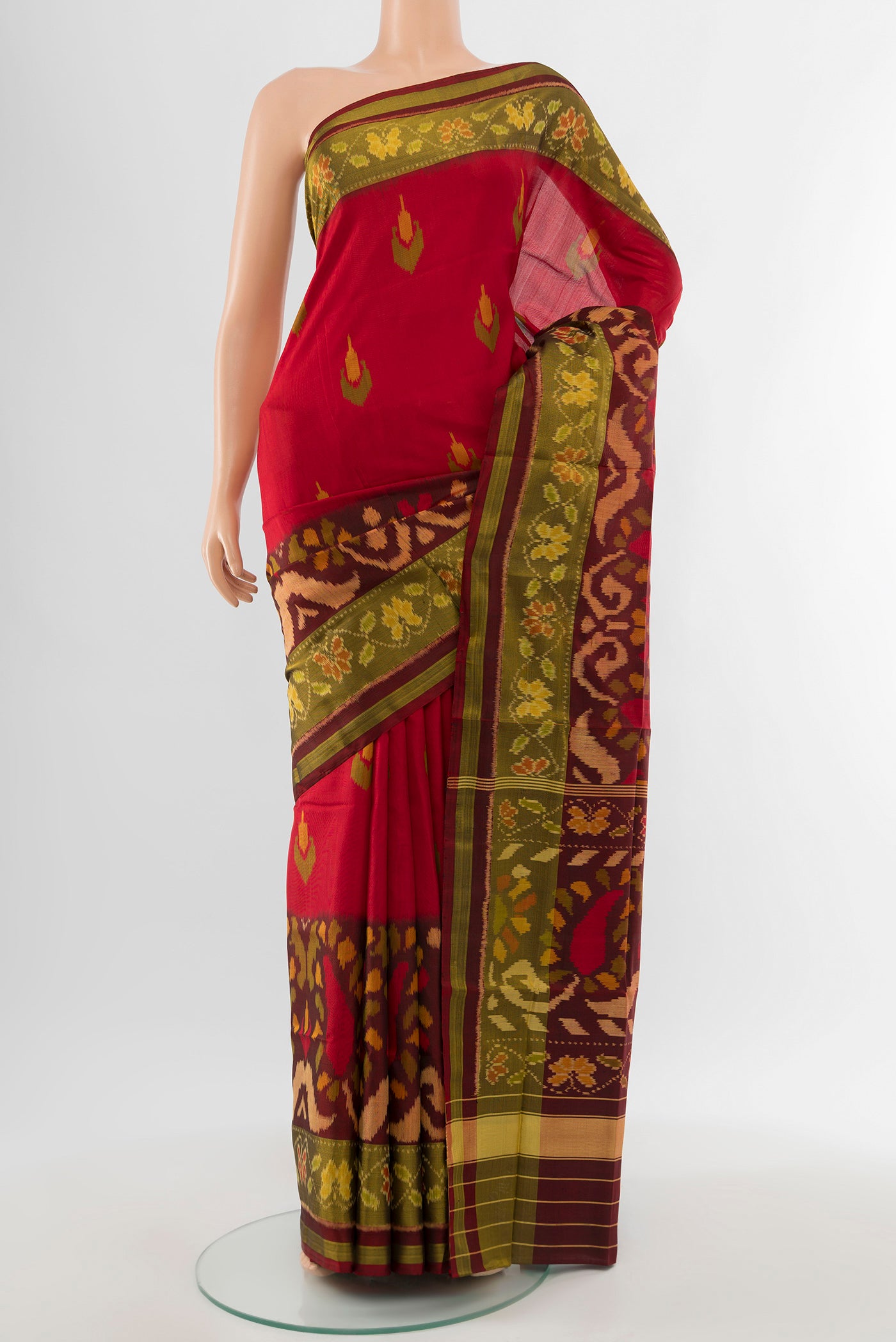 Multi Color Rajkot Patola Silk Saree with Ikat Print on the body and Silk Border.  displayed on a mannequin