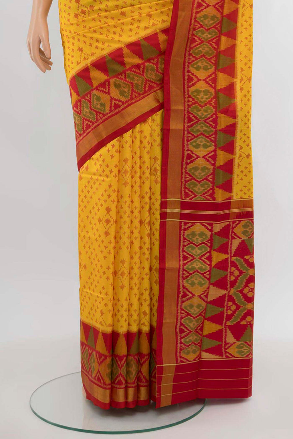 Pleats and pallu of Yellow Rajkot Patola Silk Saree with Ikat Print on the body and Silk Border. 