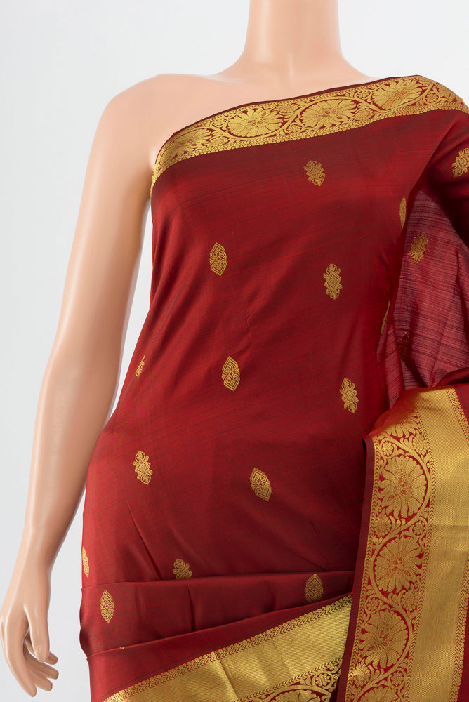 Border image of Maroon Kanchipuram Silk Saree with Zari Butta on the body and Silk Border. 