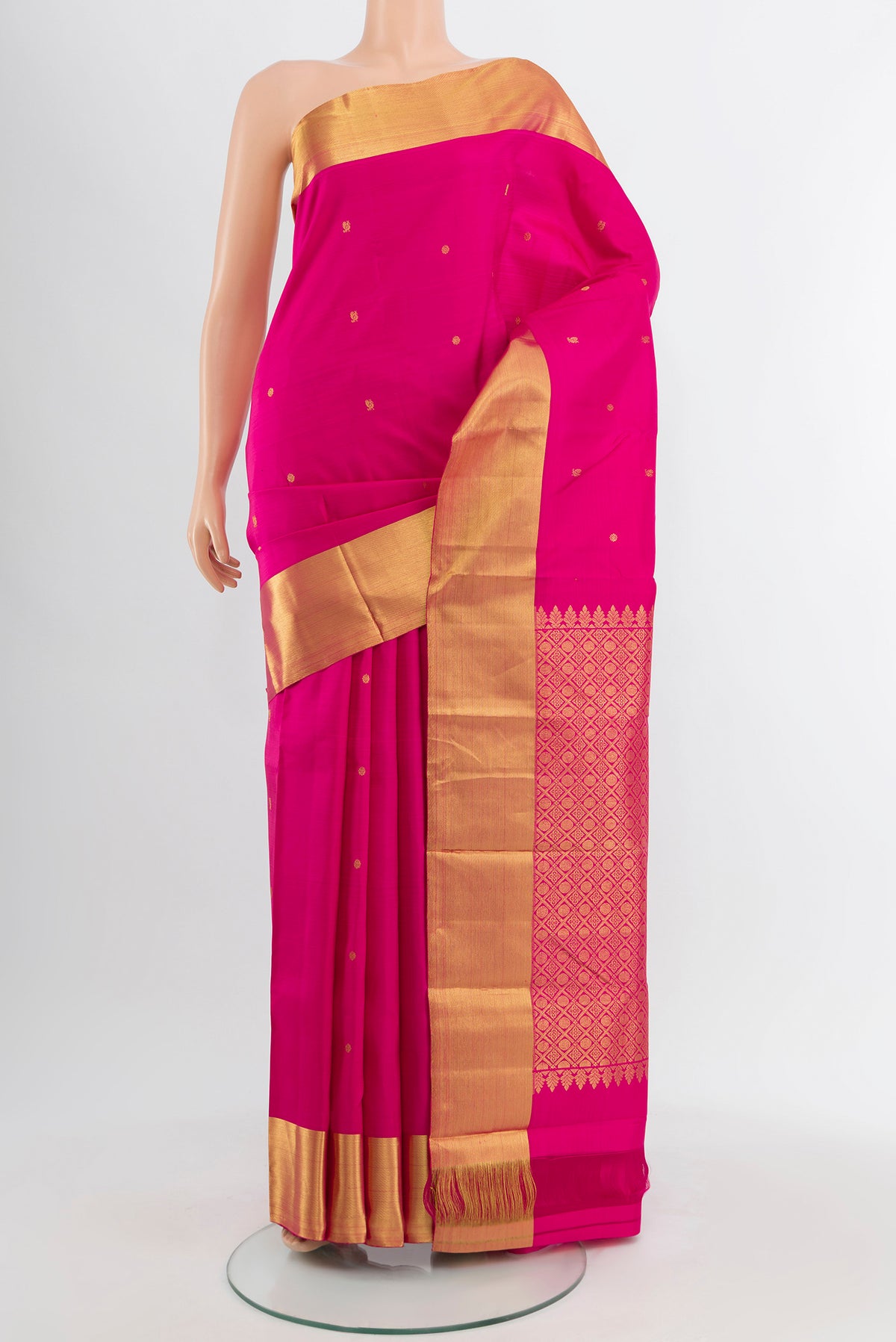 Magenta Kanchipuram Silk Saree with Zari Butta on the body and Silk Border.  displayed on a mannequin
