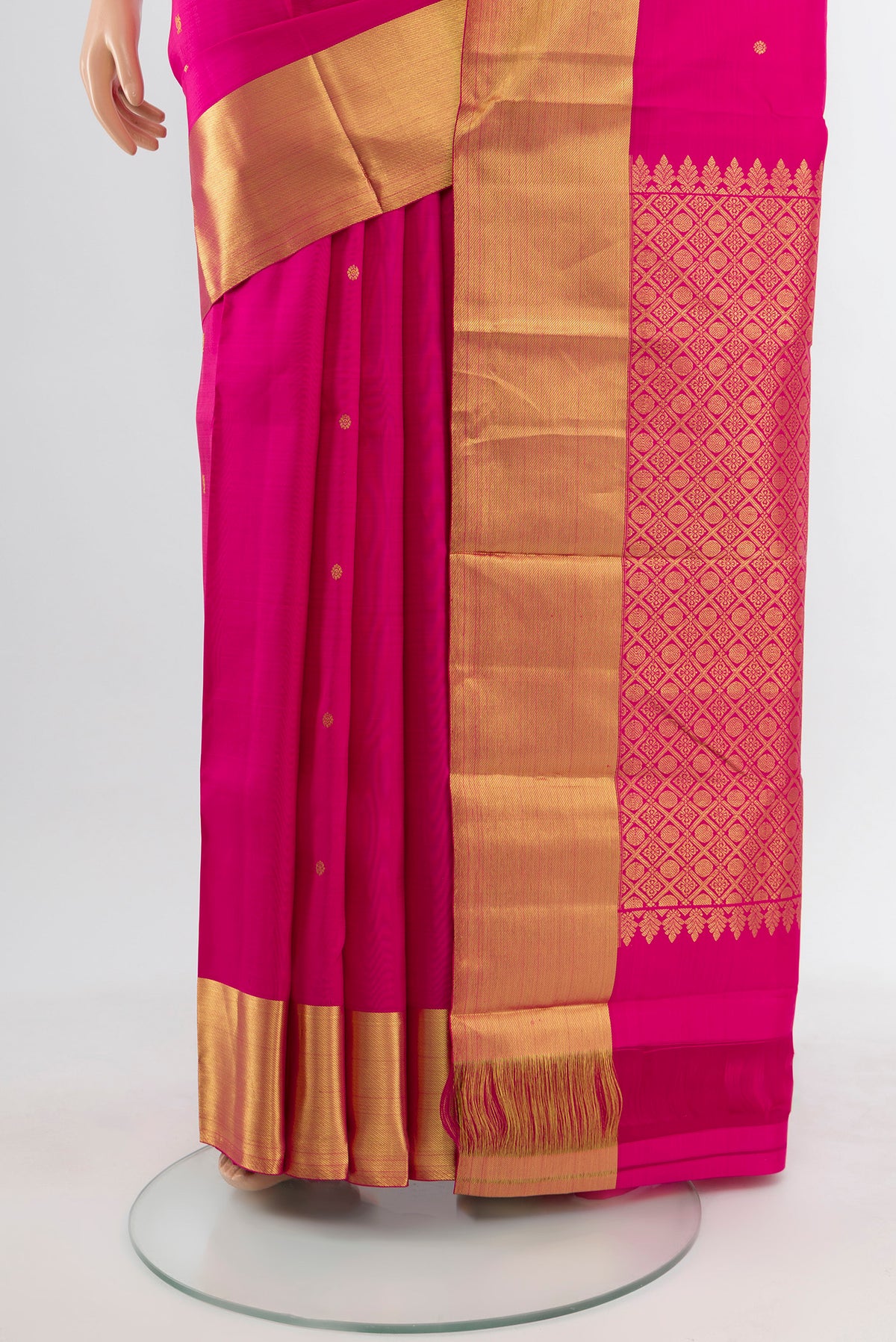 Pleats and pallu of Magenta Kanchipuram Silk Saree with Zari Butta on the body and Silk Border. 