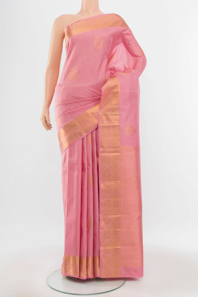 Pure Silk Pure Zari Rose Gold Kanchipuram Saree with Zari Butta on the body and Silk Border.  displayed on a mannequin