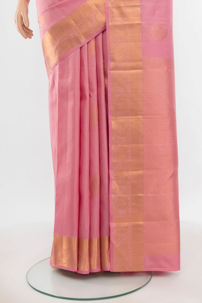 Pleats and pallu of Pure Silk Pure Zari Rose Gold Kanchipuram Saree with Zari Butta on the body and Silk Border. 