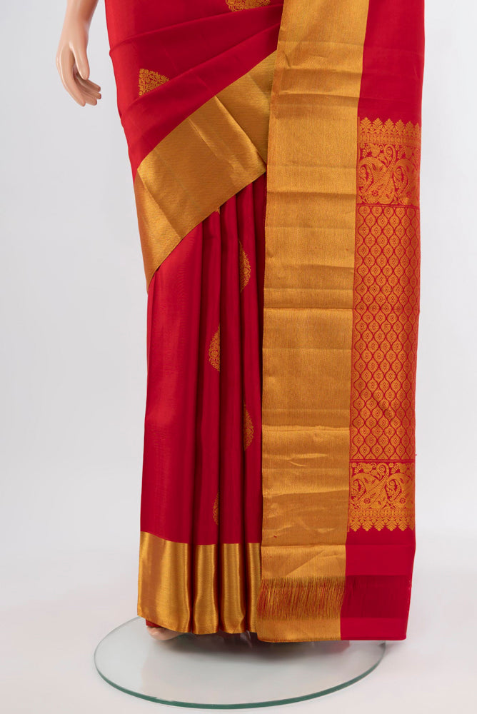 Pleats and pallu of Red Kanchipuram Silk Saree with Zari Butta on the body and Silk Border. 