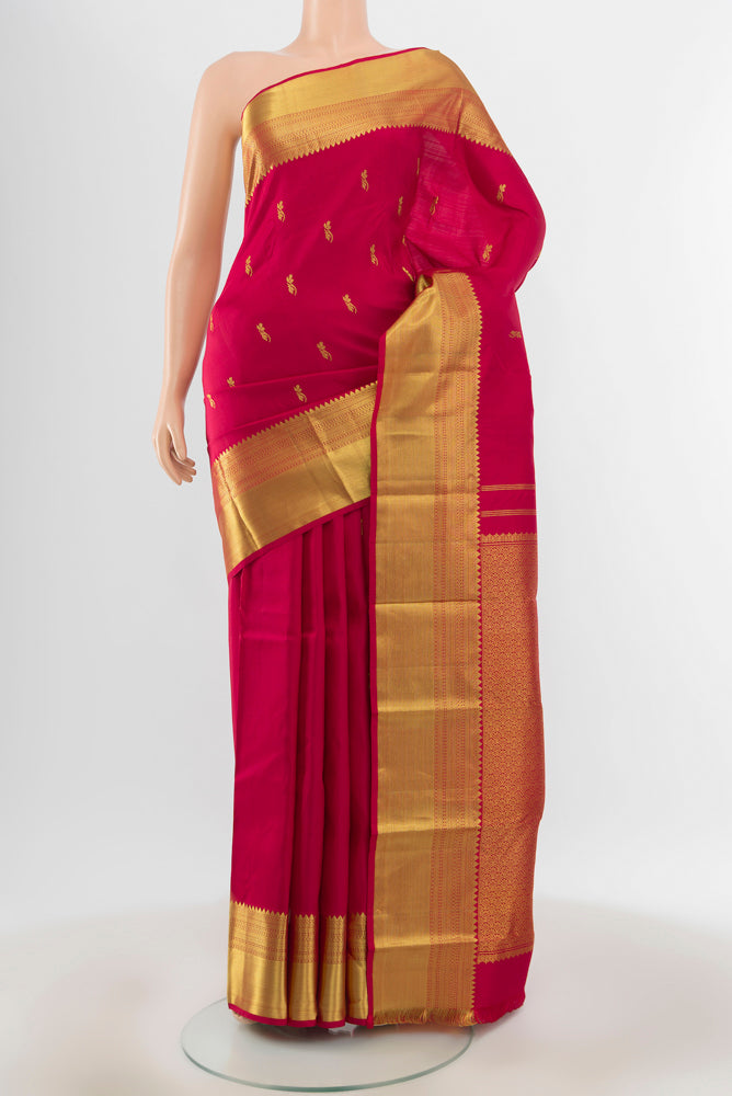 Pure Silk Pure Zari Maroon Kanchipuram Saree with Zari Butta on the body and Silk Border.  displayed on a mannequin