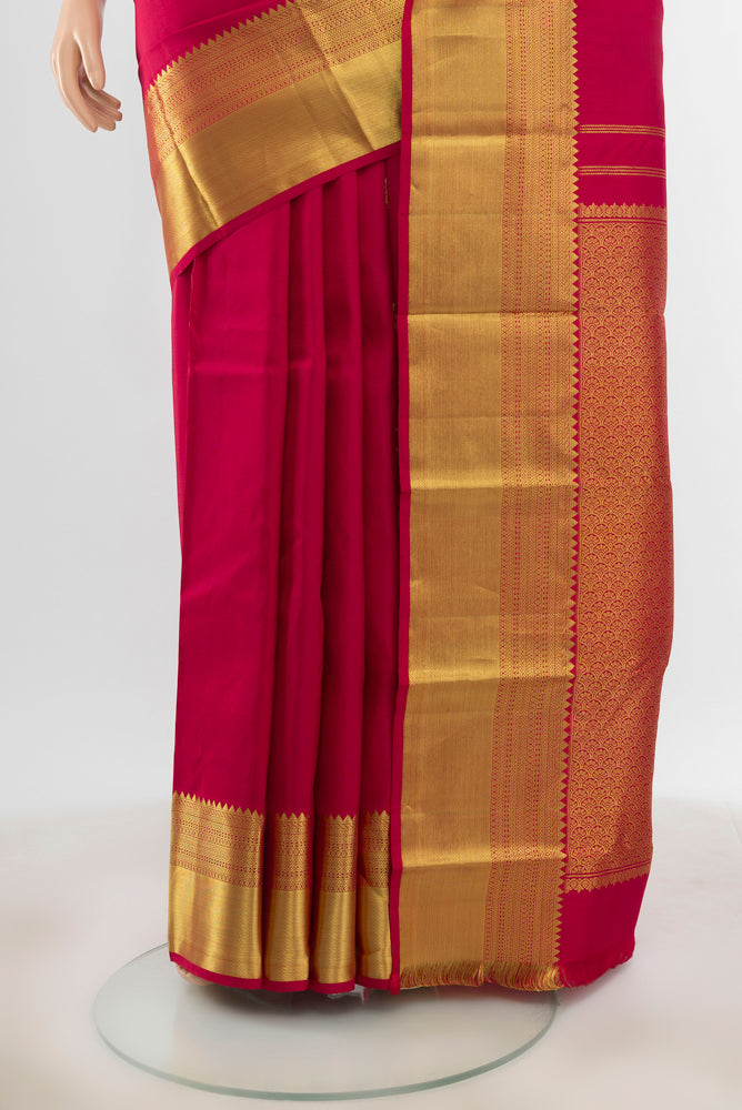Pleats and pallu of Pure Silk Pure Zari Maroon Kanchipuram Saree with Zari Butta on the body and Silk Border. 