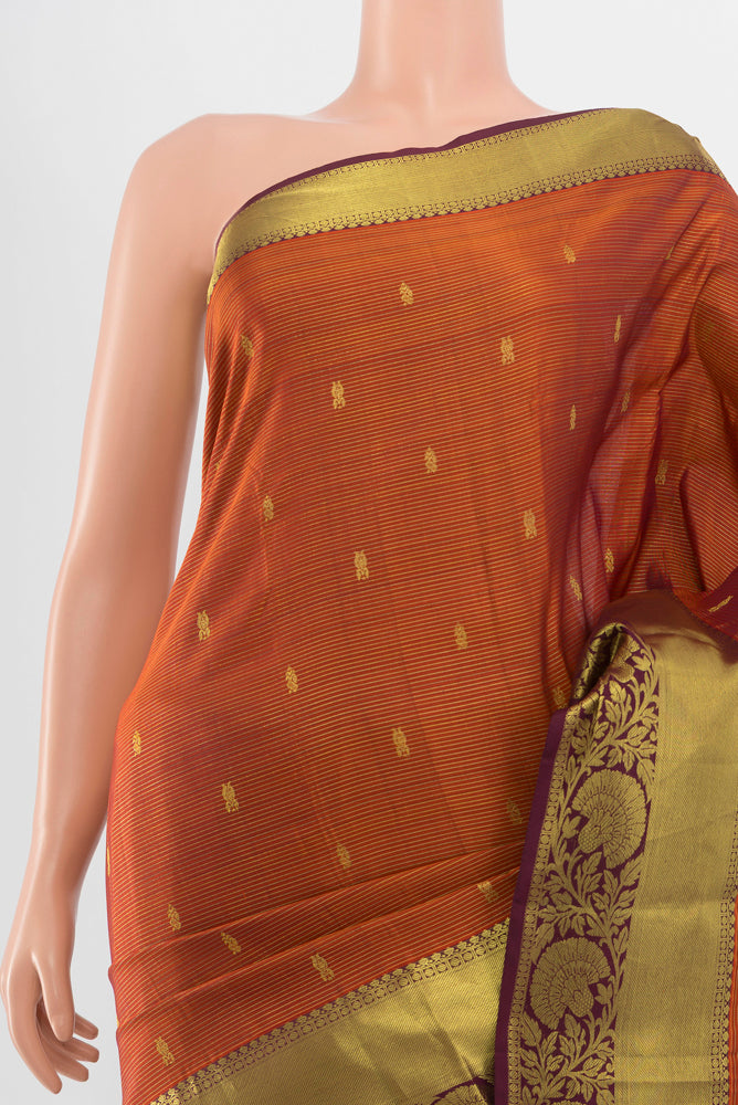 Border image of Pure Silk Pure Zari Rust Kanchipuram Saree with Zari Butta on the body and Silk Border. 