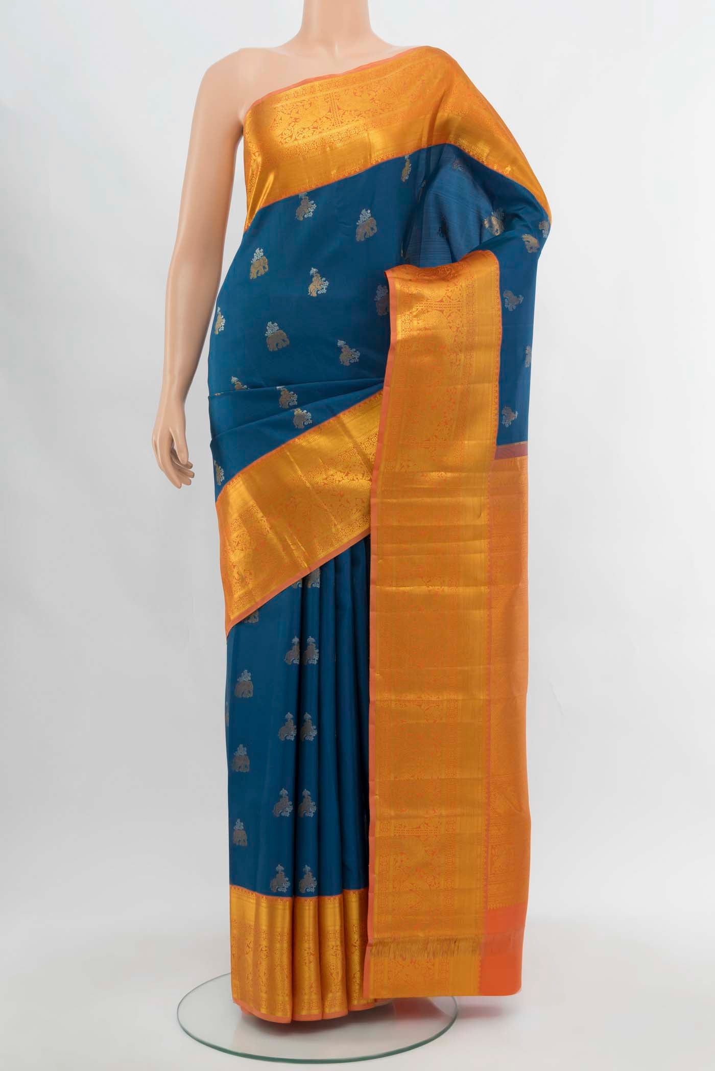 Dark Blue Kanjivaram Silk Saree with Zari Butta on the body and Silk Border.  displayed on a mannequin