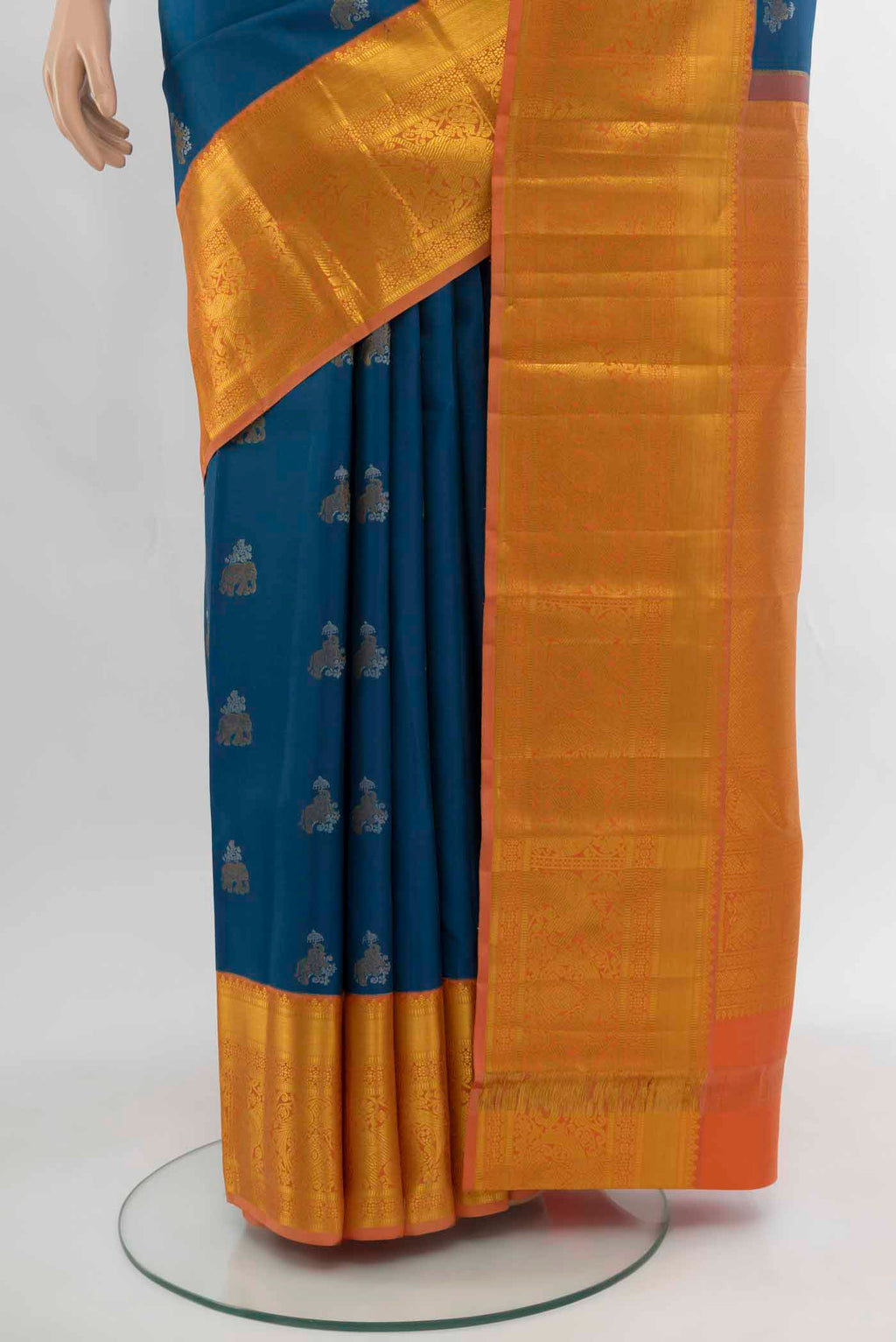 Pleats and pallu of Dark Blue Kanjivaram Silk Saree with Zari Butta on the body and Silk Border. 