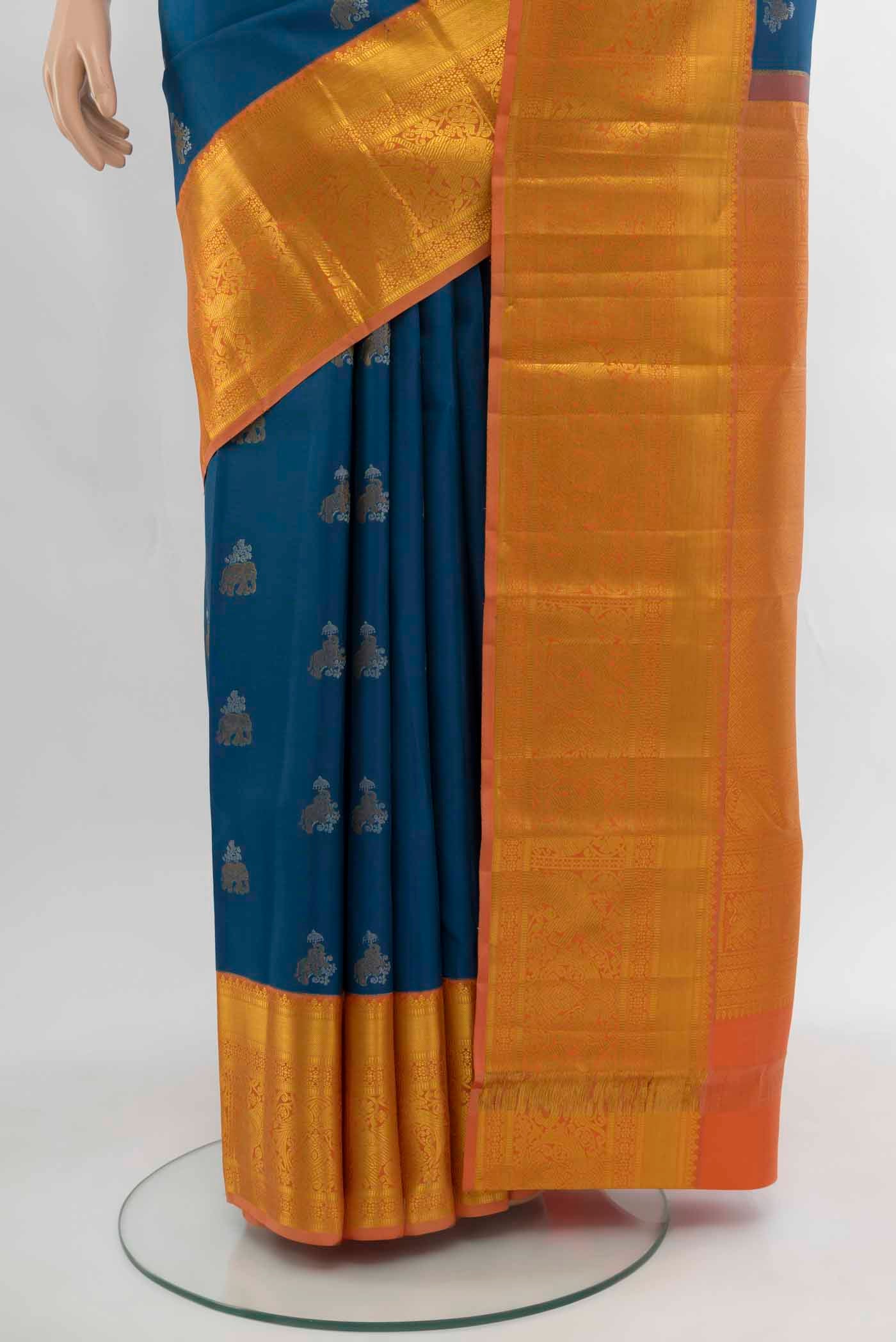 Pleats and pallu of Dark Blue Kanjivaram Silk Saree with Zari Butta on the body and Silk Border. 