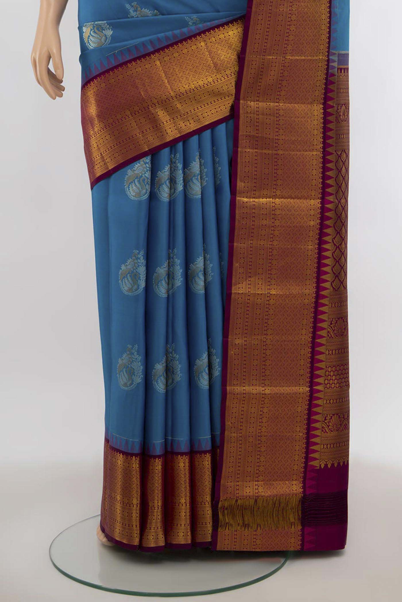 Pleats and pallu of Dark Blue Kanjivaram Silk Saree with Zari Butta on the body and Silk Border. 