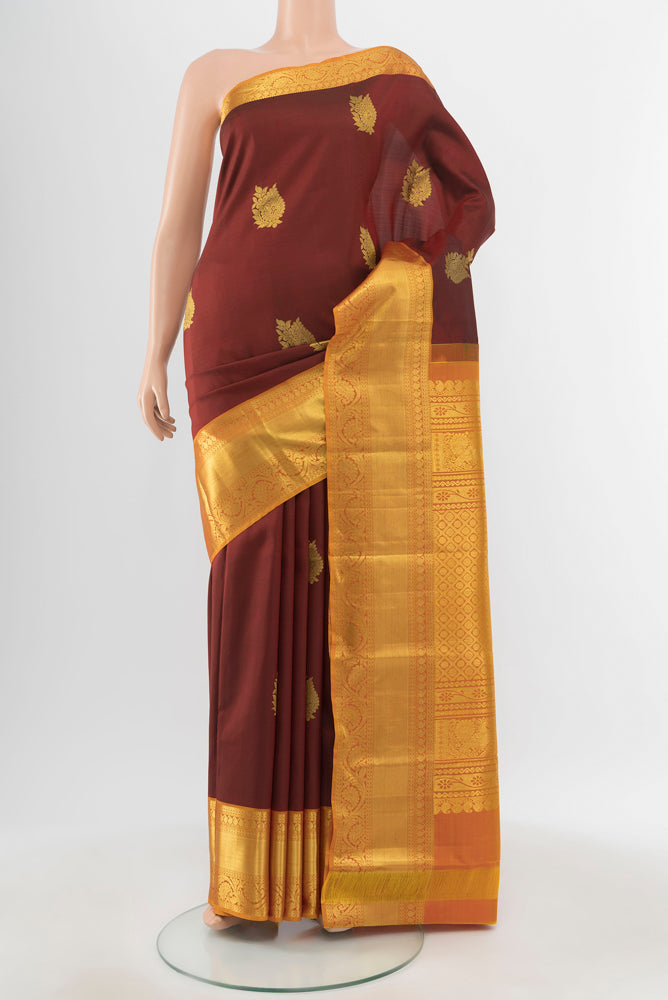 Pure Silk Pure Zari Maroon Kanchipuram Saree with Zari Butta on the body and Silk Border.  displayed on a mannequin
