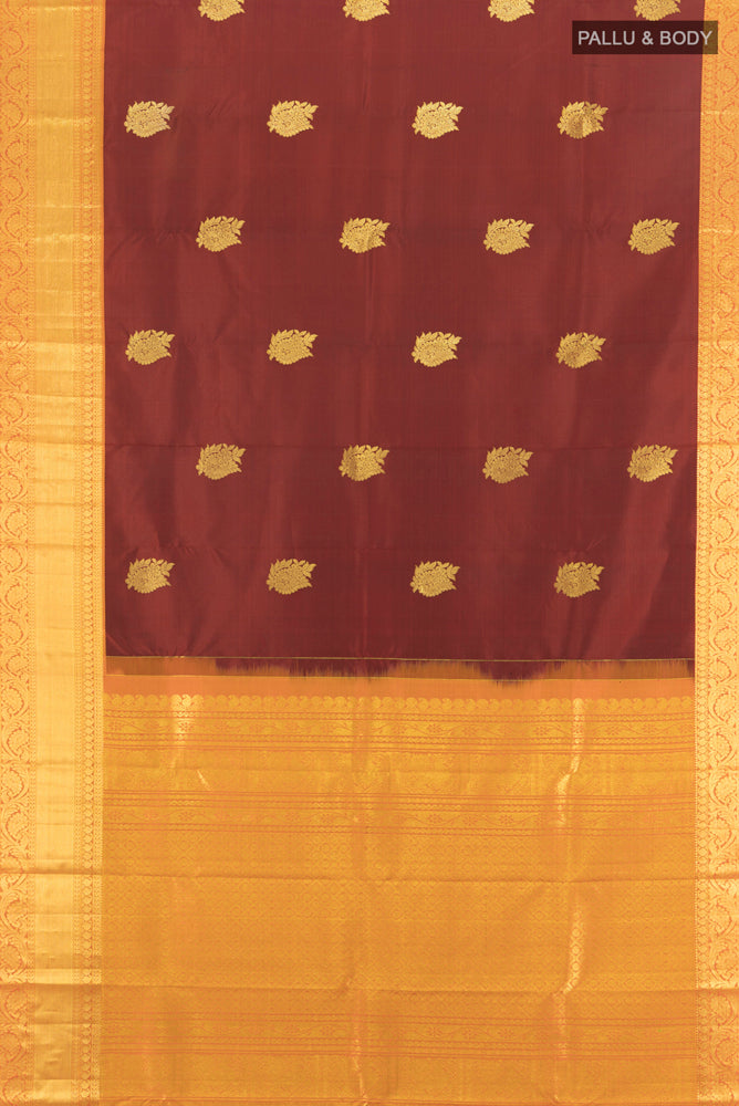 Flat view of Pure Silk Pure Zari Maroon Kanchipuram Saree with Zari Butta on the body and Silk Border. 