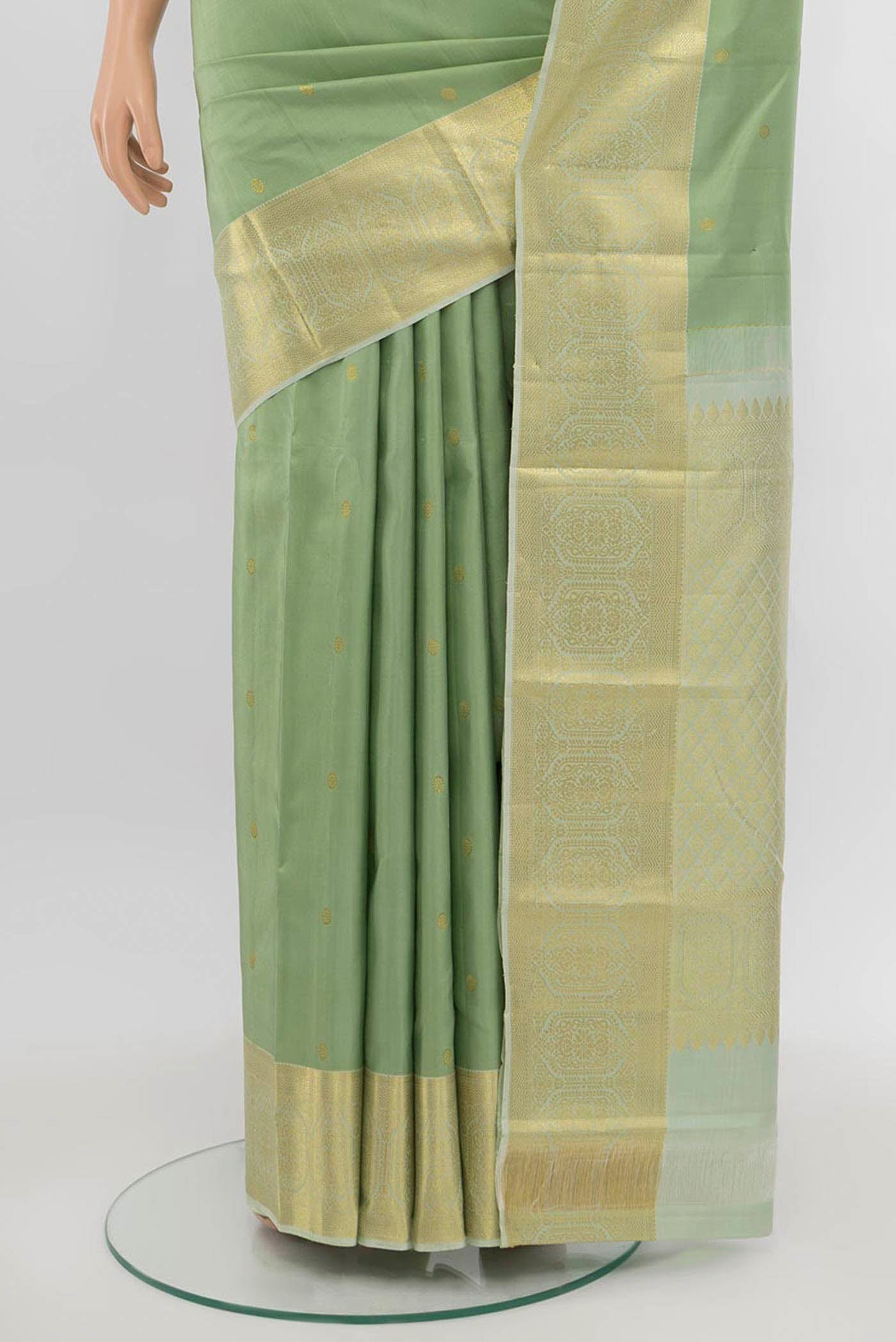 Pleats and pallu of Pista Green Kanchipuram Silk Saree with Zari Butta on the body and Silk Border. 