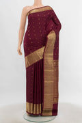 Pure Silk Pure Zari Maroon Kanchipuram Saree with Zari Butta on the body and Silk Border.  displayed on a mannequin