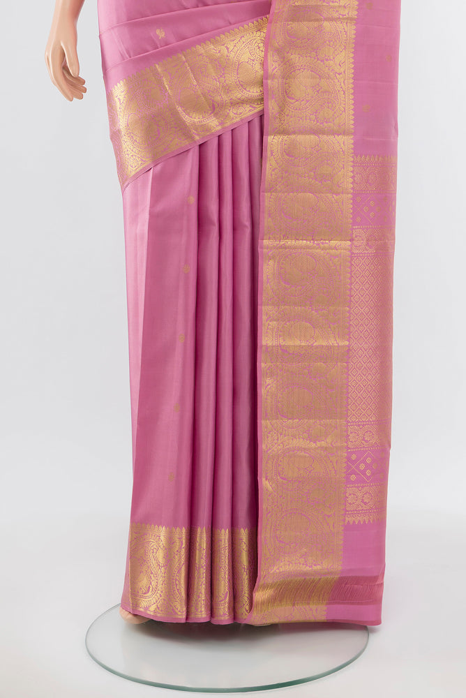 Pleats and pallu of Pure Silk Pure Zari Rose Gold Kanchipuram Saree with Zari Brocade on the body and Silk Border. 