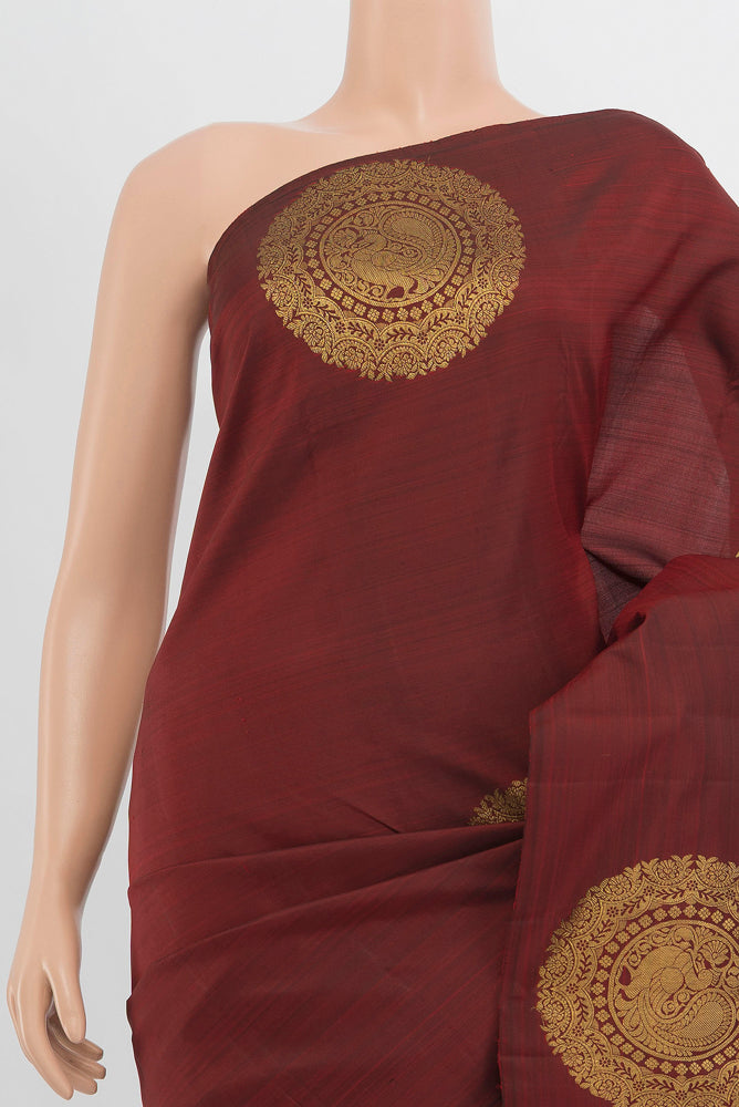 Border image of Pure Silk Pure Zari Maroon Kanchipuram Saree with Zari Butta on the body and Silk Border. 
