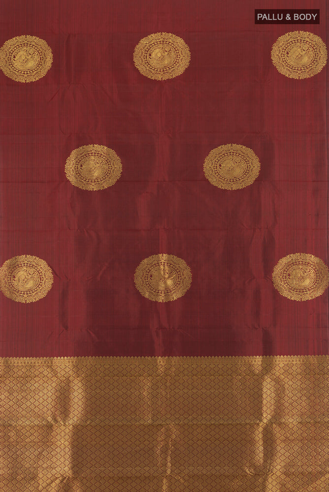 Flat view of Pure Silk Pure Zari Maroon Kanchipuram Saree with Zari Butta on the body and Silk Border. 