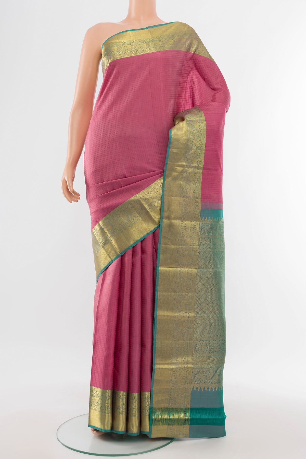 Pure Silk Pure Zari Rose pink Kanjivaram Saree with Zari Butta on the body and Silk Border.  displayed on a mannequin