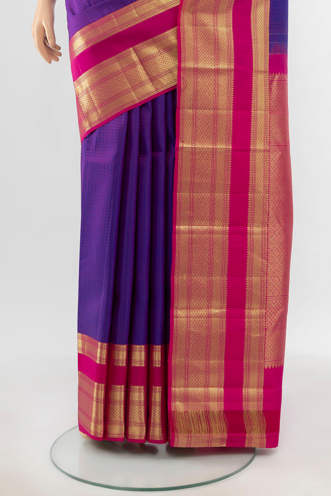 Pleats and pallu of Pure Silk Pure Zari Purple Kanjivaram Saree with Zari Butta on the body and Silk Border. 