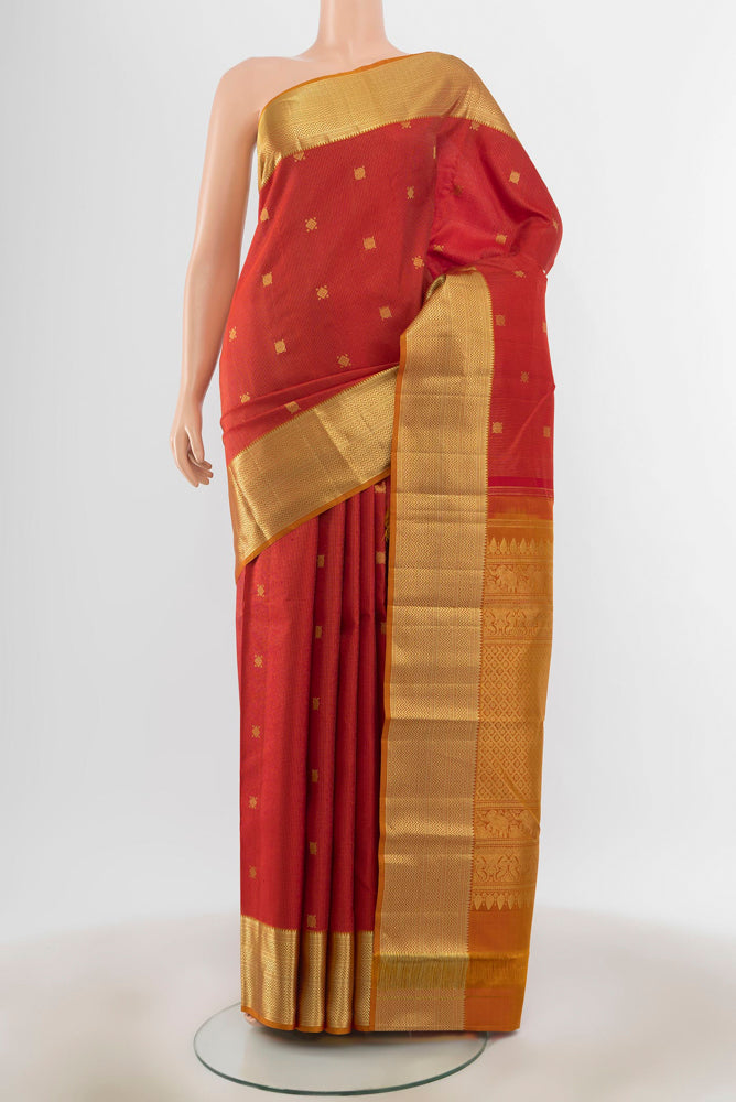 Maroon Kanjivaram Silk Saree with Zari Butta on the body and Silk Border.  displayed on a mannequin