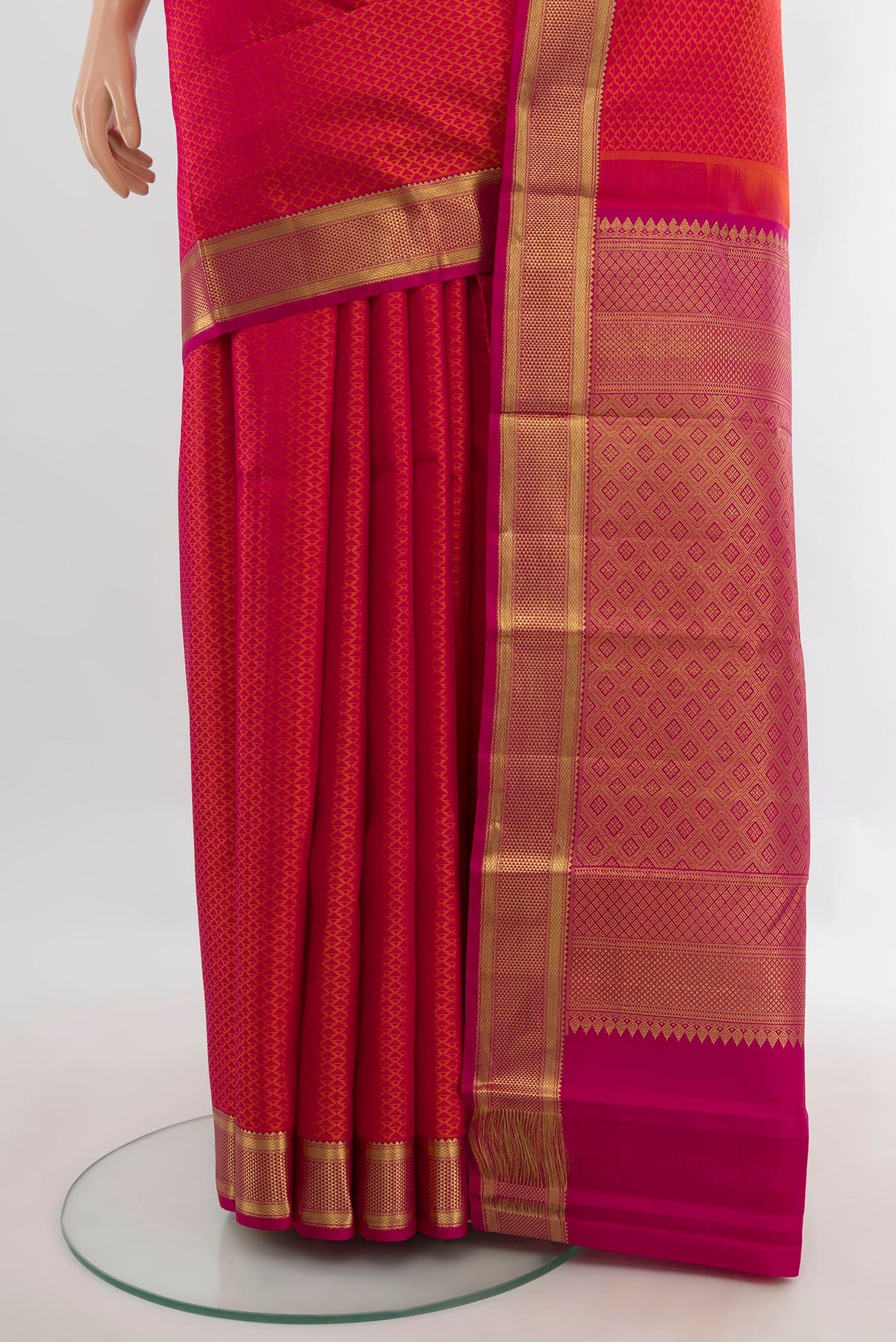 Pleats and pallu of Pure Silk Brick Orange Kanjivaram Saree with Jacquard design on the body and Zari Border. 
