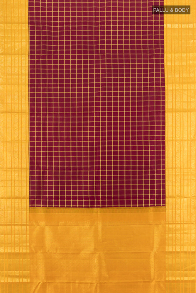 Flat view of Maroon Kanchipuram Silk Saree with Zari Butta on the body and Silk Border. 