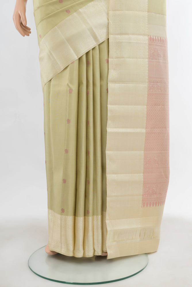Pleats and pallu of Light Green Kanchipuram Silk Saree with Zari Butta on the body and Silk Border. 