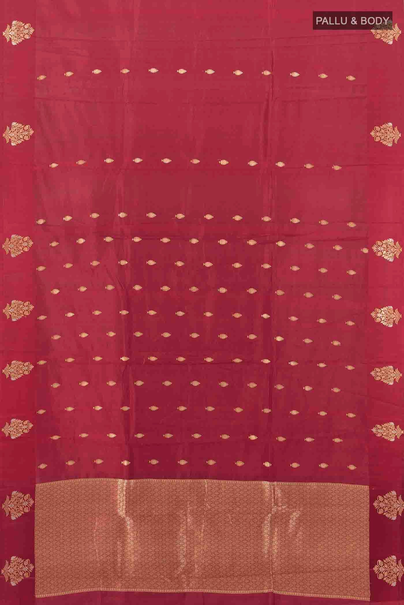 Flat view of Maroon Banarasi Katan Silk Saree with Zari Butta on the body and Silk Border. 