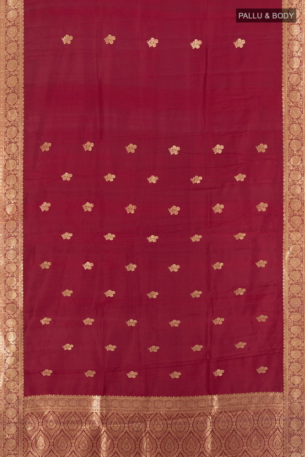Flat view of Maroon Banarasi Katan Silk Saree with Zari Butta on the body and Zari Border. 