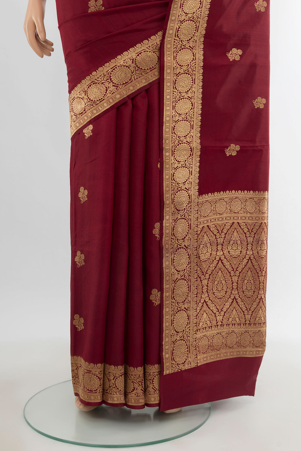 Pleats and pallu of Maroon Banarasi Katan Silk Saree with Zari Butta on the body and Zari Border. 