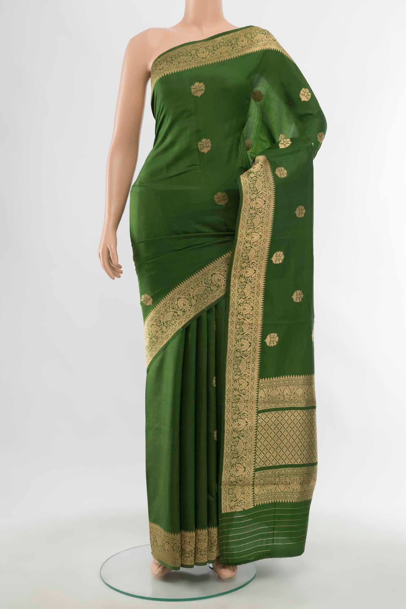 Green Banarasi Katan Silk Saree with Zari Butta on the body and Zari Border displayed on a mannequin