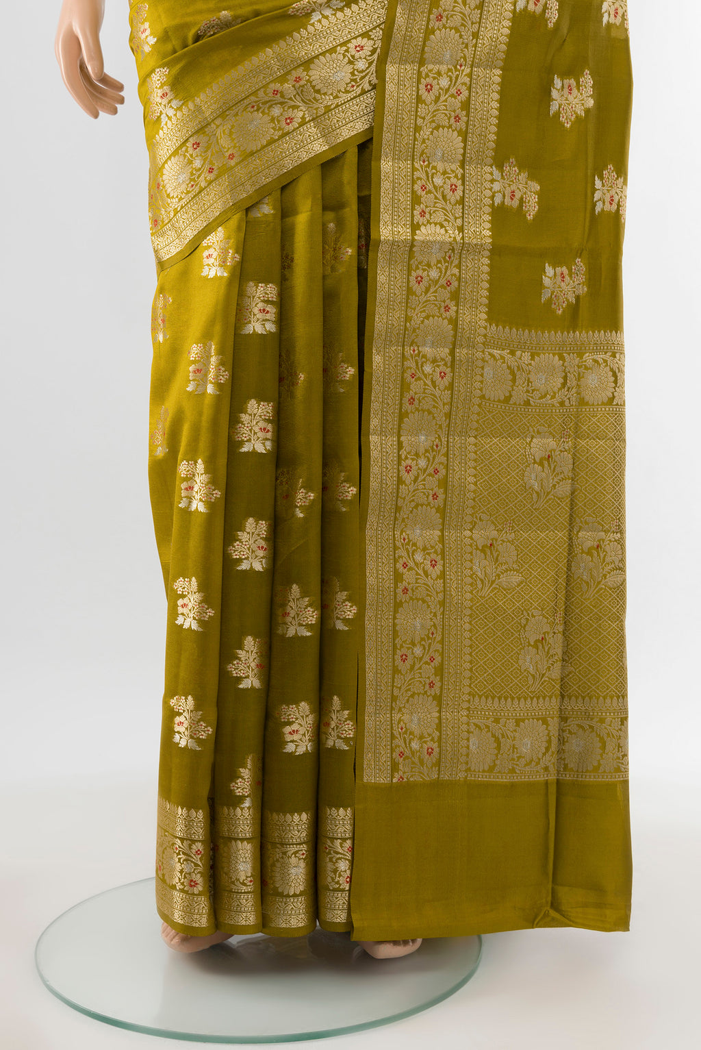 Pleats and pallu of Pure Silk Pure Zari Mehandi Green Banarasi Raw Saree with Zari Butta on the body and Silk Border. 
