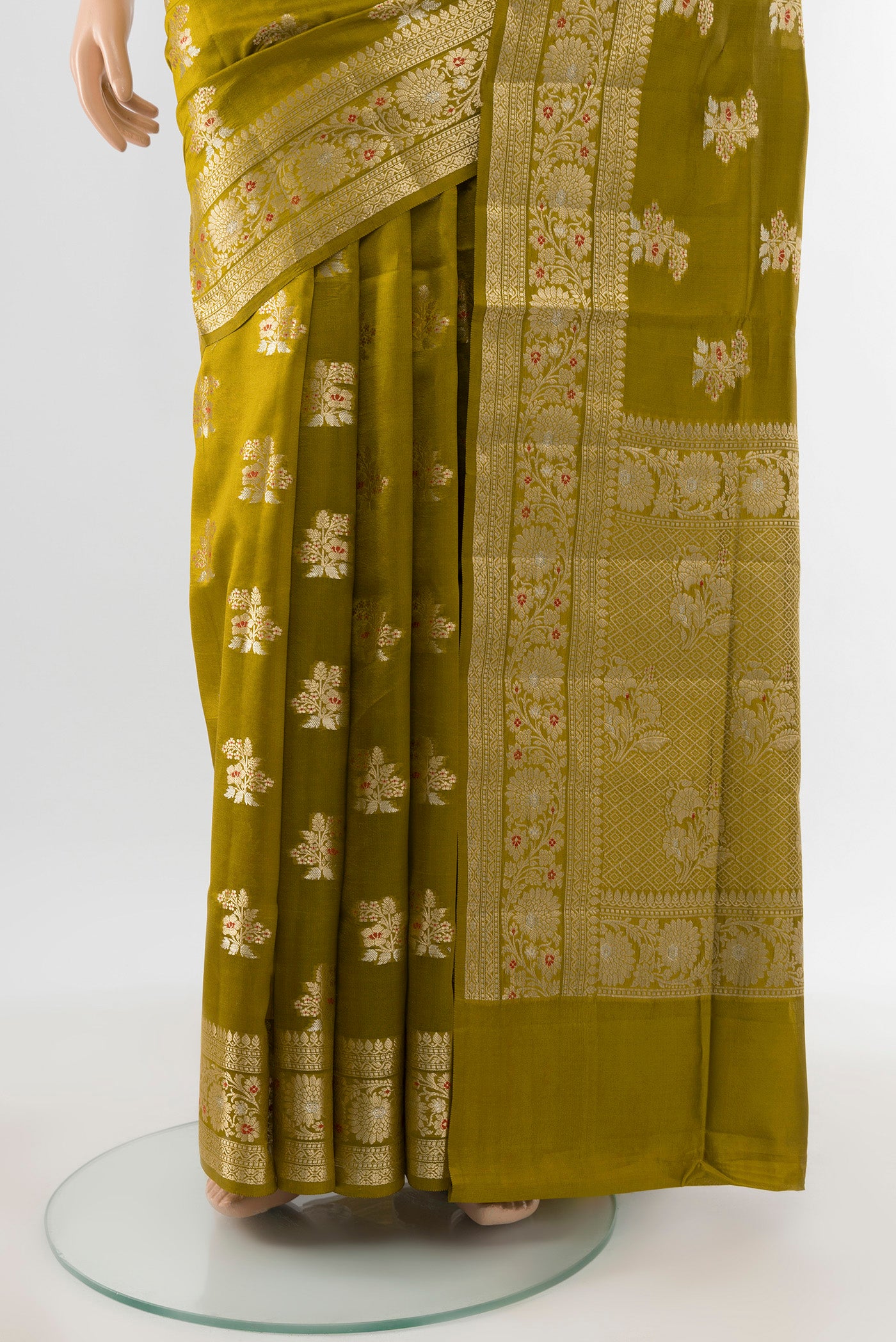 Pleats and pallu of Pure Silk Pure Zari Mehandi Green Banarasi Raw Saree with Zari Butta on the body and Silk Border. 