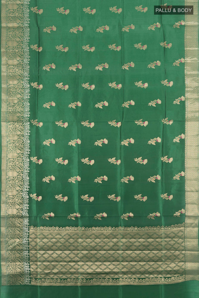 Flat view of Bottle Green Banarasi Raw Silk Saree with Zari Butta on the body and Silk Border. 