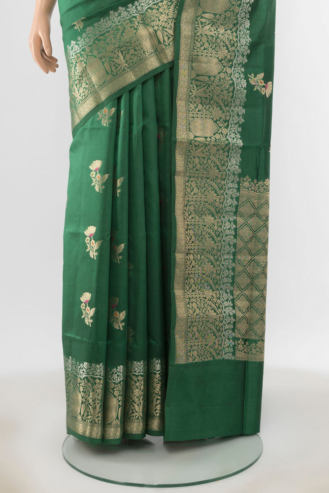 Pleats and pallu of Bottle Green Banarasi Raw Silk Saree with Zari Butta on the body and Silk Border. 