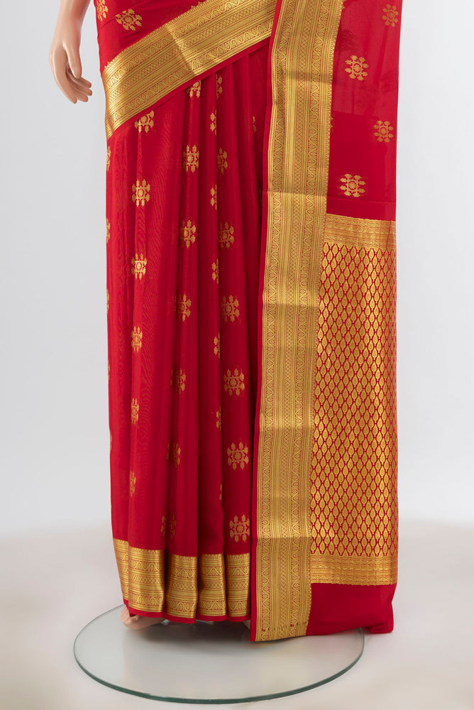 Pleats and pallu of Red Mysore Silk Saree with Zari Butta on the body and Silk Border. 